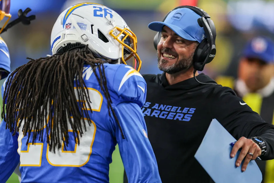 Inglewood, CA, Monday, December 8, 2025 - Los Angeles Chargers cornerback Donte Jackson (26) celebrates with coach Jesse Minter after an interception against the Philadelphia Eagles at SoFi Stadium. (Robert Gauthier/Los Angeles Times via Getty Images)