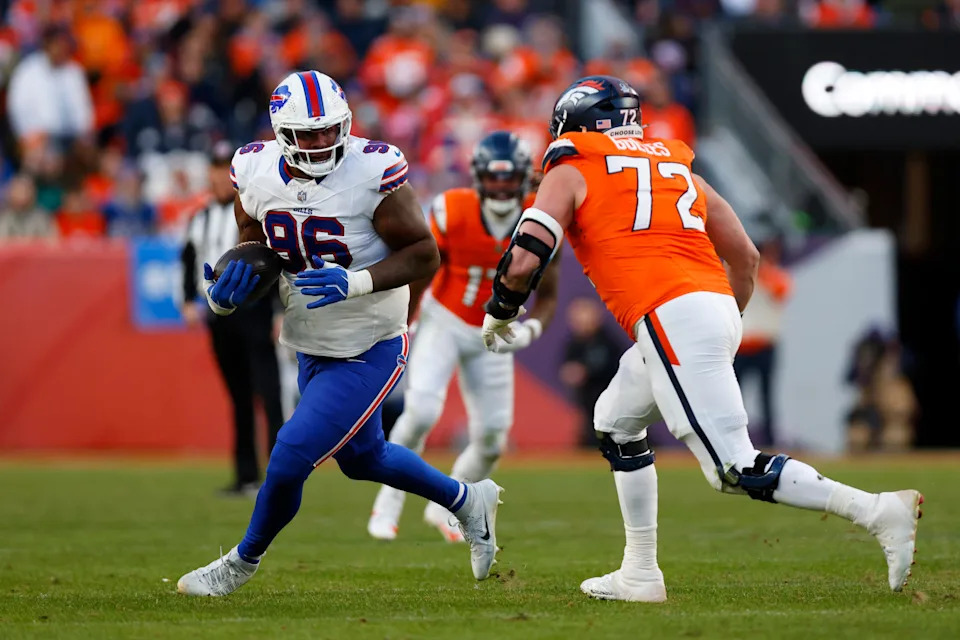 DENVER, COLORADO - JANUARY 17: Deone Walker #96 of the Buffalo Bills runs with the ball after an interception against Bo Nix #10 of the Denver Broncos in the AFC Divisional Playoff game at Empower Field At Mile High. (Photo by Justin Edmonds/Getty Images)