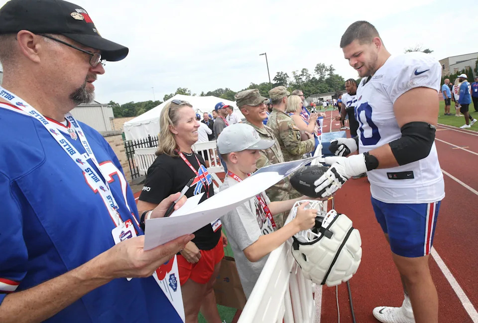 Bills offensive lineman Alec Anderson signs autographs at the end of the Buffalo Bills training camp.