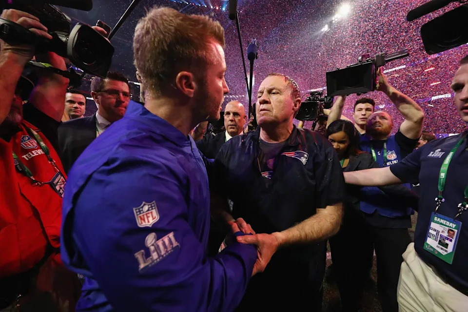 Rams coach Sean McVay, left, shakes hands with New England Patriots coach Bill Belichick.