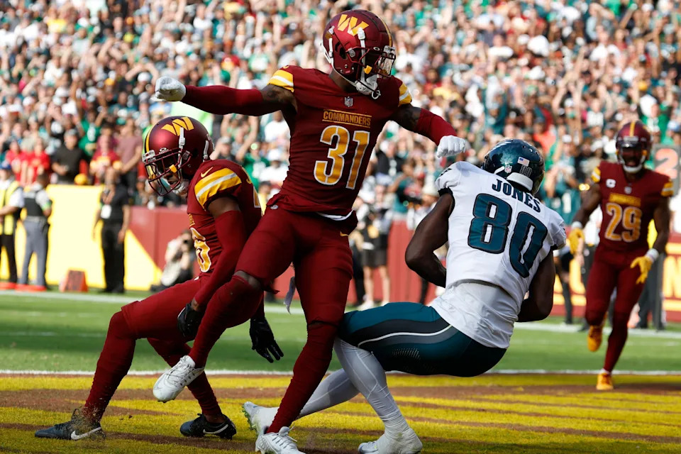 Oct 29, 2023; Landover, Maryland, USA; Philadelphia Eagles wide receiver Julio Jones (80) catches a touchdown pass as Washington Commanders safety Kamren Curl (31) defends during the fourth quarter at FedExField. Mandatory Credit: Geoff Burke-USA TODAY Sports