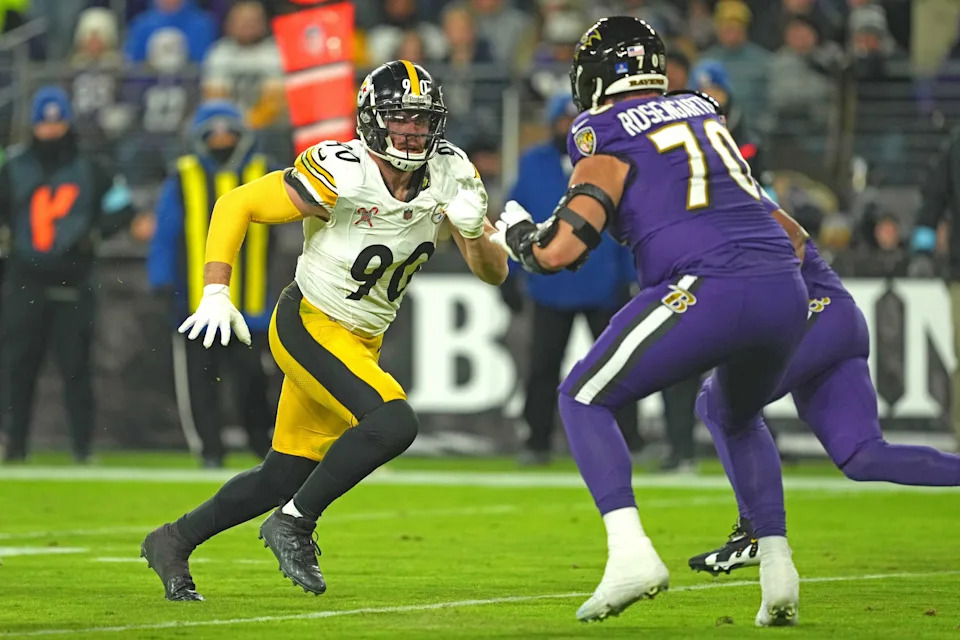Dec 21, 2024; Baltimore, Maryland, USA; Pittsburgh Steelers linebacker T.J. Watt (90) rushes in the second quarter against Baltimore Ravens tackle Roger Rosengarten (70) at M&T Bank Stadium. Mandatory Credit: Mitch Stringer-Imagn Images