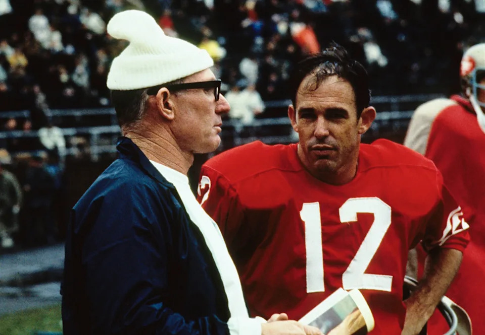 San Francisco 49ers former quarterback Y.A. TITTLE (left) talks with quarterback John Brodie (12).