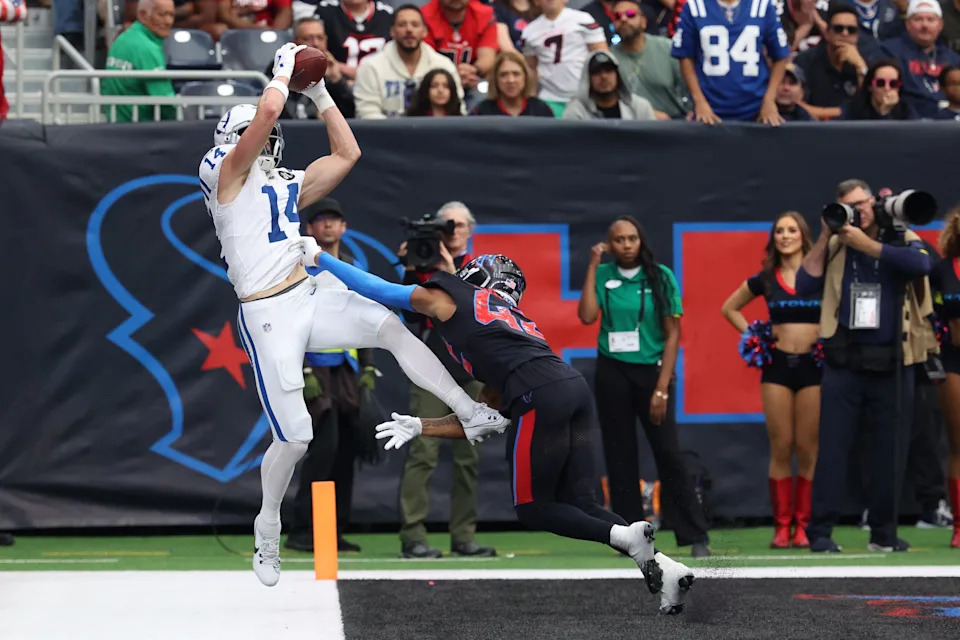 Jan 4, 2026; Houston, Texas, USA; Indianapolis Colts wide receiver Alec Pierce (14) is pushed out of bounds by Houston Texans cornerback Ja'marcus Ingram (42) during the second half at NRG Stadium. Mandatory Credit: Thomas Shea-Imagn Images