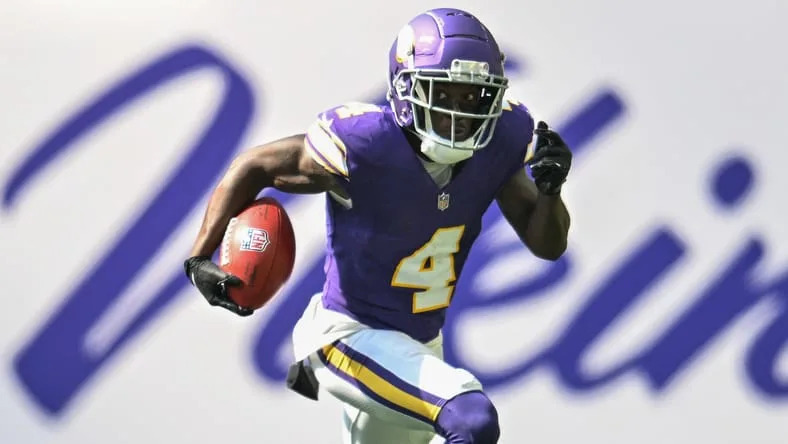 Vikings receiver Brandon Powell runs the ball against the Houston Texans.