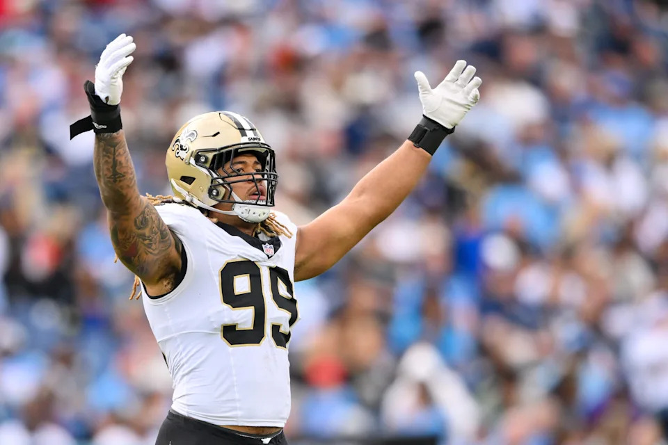 Dec 28, 2025; Nashville, Tennessee, USA; New Orleans Saints defensive end Chase Young (99) celebrates a tackle for loss against the Tennessee Titans during the second half at Nissan Stadium. Mandatory Credit: Steve Roberts-Imagn Images