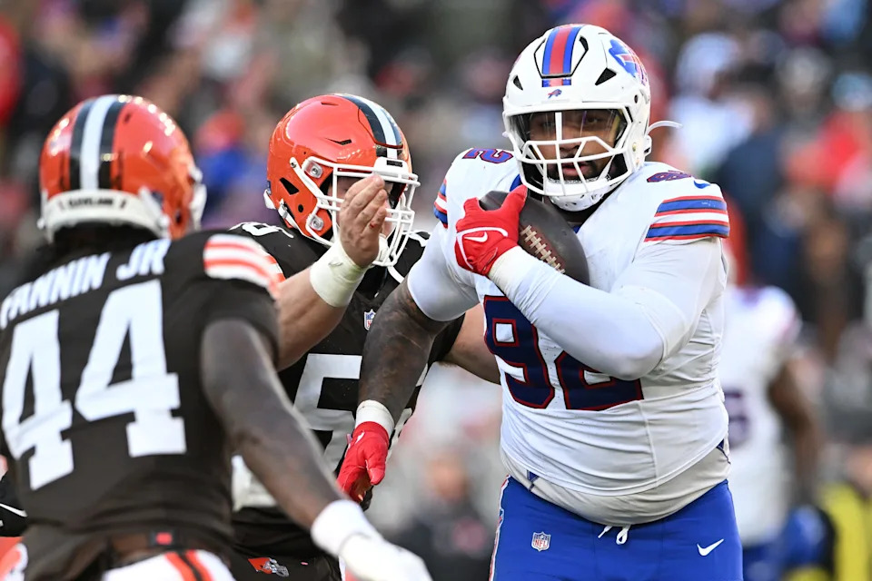 Daquan Jones #92 of the Buffalo Bills carries the ball after an interception in the third quarter of the game against the Cleveland Browns at Huntington Bank Field on December 21, 2025 in Cleveland, Ohio.