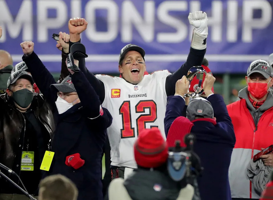Tampa Bay Buccaneers quarterback Tom Brady (12) exalts during the presentation off the George Halas Trophy.