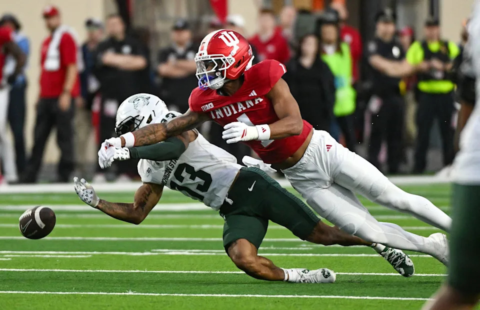 Oct 18, 2025; Bloomington, Indiana, USA; Indiana Hoosiers defensive back Amare Ferrell (1) breaks up a pass intended for Michigan State Spartans linebacker Isaac Smith (13) during the second half at Memorial Stadium. Mandatory Credit: Robert Goddin-Imagn Images