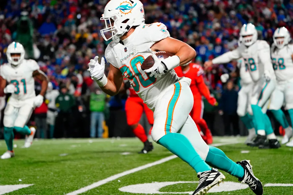 Dec 17, 2022; Orchard Park, New York, USA; Miami Dolphins full back Alec Ingold (30) runs with the ball against the Buffalo Bills during the second half at Highmark Stadium.