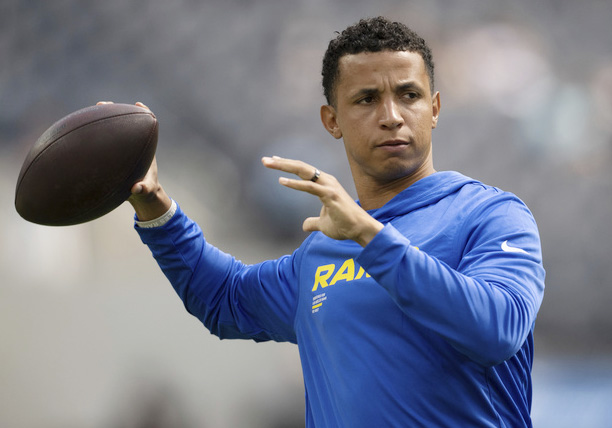 Los Angeles Rams pass game coordinator Nate Scheelhaase throws the ball before an NFL preseason football game against the Dallas Cowboys, Saturday, Aug. 9, 2025, in Inglewood, Calif. 