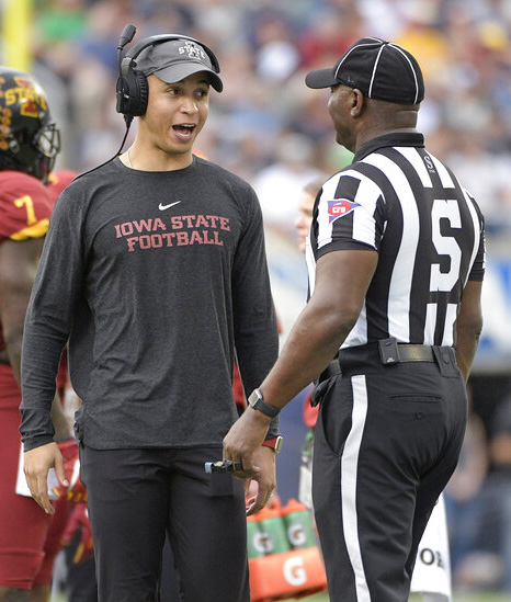 Iowa State wide receivers coach Nate Scheelhaase, center, talks to an official during a timeout in the first half of the Camping World Bowl NCAA college football game against Notre Dame Saturday, Dec. 28, 2019, in Orlando, Fla. 