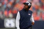 Denver Broncos defensive back coach Christian Parker looks on against the Las Vegas Raiders...