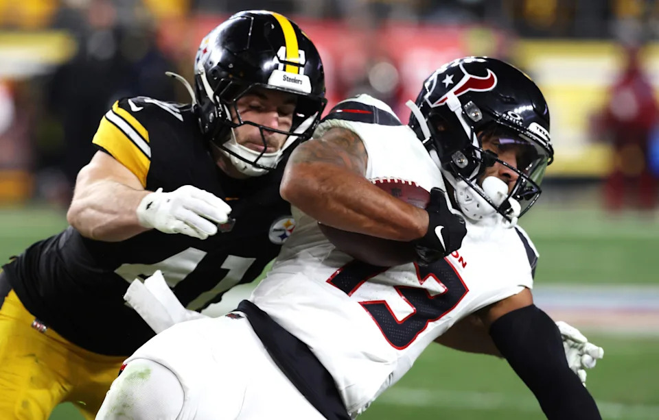 Jan 12, 2026; Pittsburgh, PA, USA; Pittsburgh Steelers linebacker Payton Wilson (41) tackles Houston Texans wide receiver Christian Kirk (13) during the first half of an AFC Wild Card Round game at Acrisure Stadium. Mandatory Credit: Charles LeClaire-Imagn Images