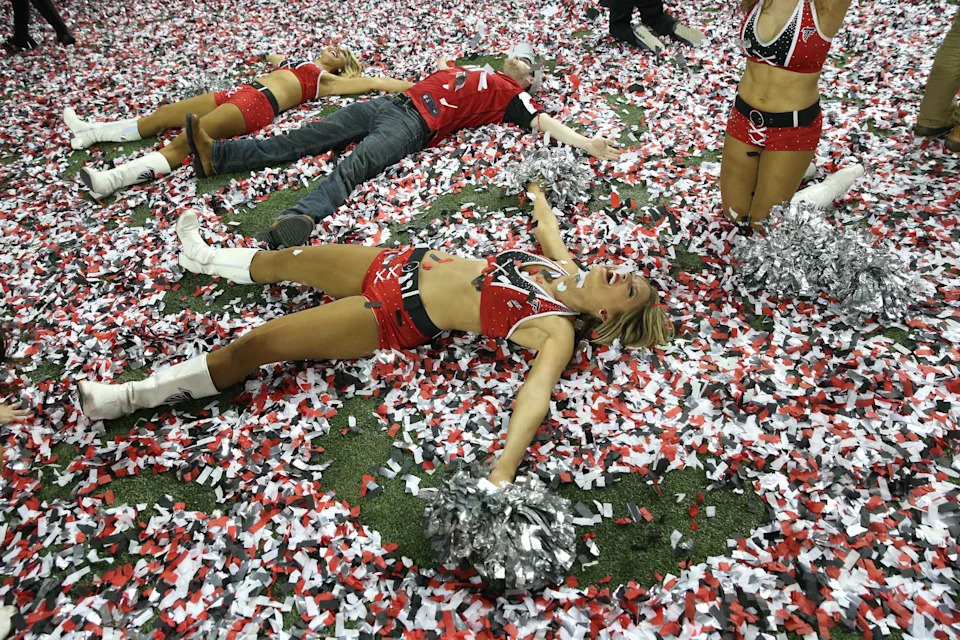 Atlanta Falcons cheerleaders celebrate in the confetti after the 2017 NFC championship game at the Georgia Dome.
