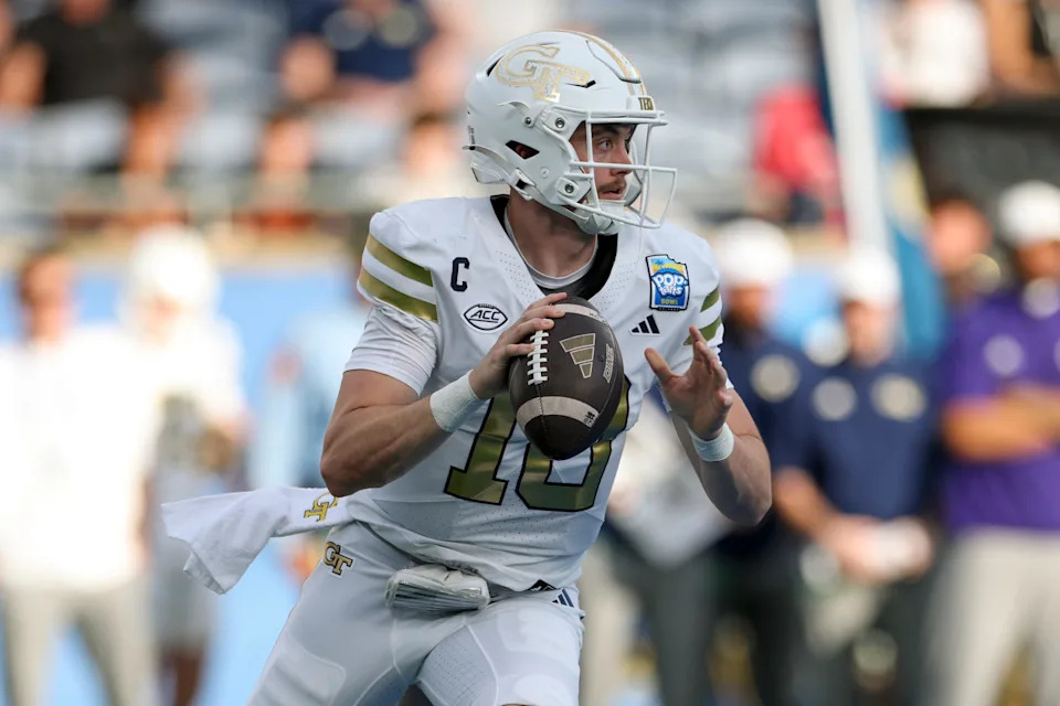 Dec 27, 2025; Orlando, FL, USA; Georgia Tech Yellow Jackets quarterback Haynes King (10) looks to pass against the BYU Cougars in the first quarter during the Pop-Tarts Bowl at Camping World Stadium. Mandatory Credit: Nathan Ray Seebeck-Imagn Images