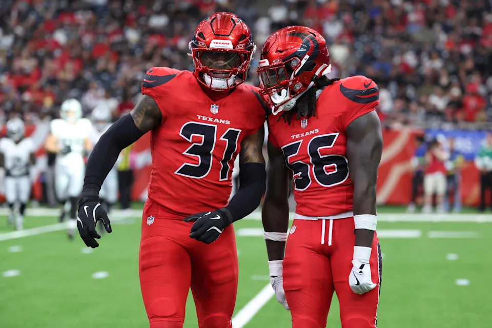 Dec 21, 2025; Houston, Texas, USA; Houston Texans linebacker Damone Clark (31) and linebacker Jamal Hill (56) react after a play during the game against the Las Vegas Raiders at NRG Stadium. Mandatory Credit: Troy Taormina-Imagn Images