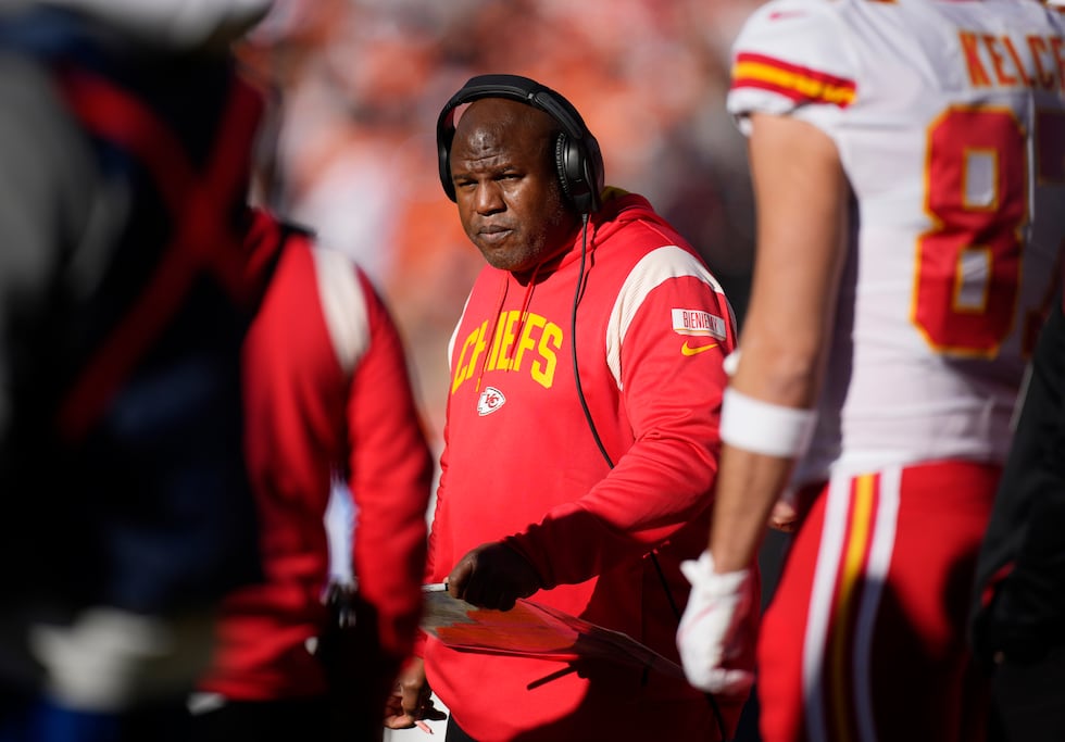 FILE - Kansas City Chiefs offensive coordinator Eric Bieniemy watches during the first half of...
