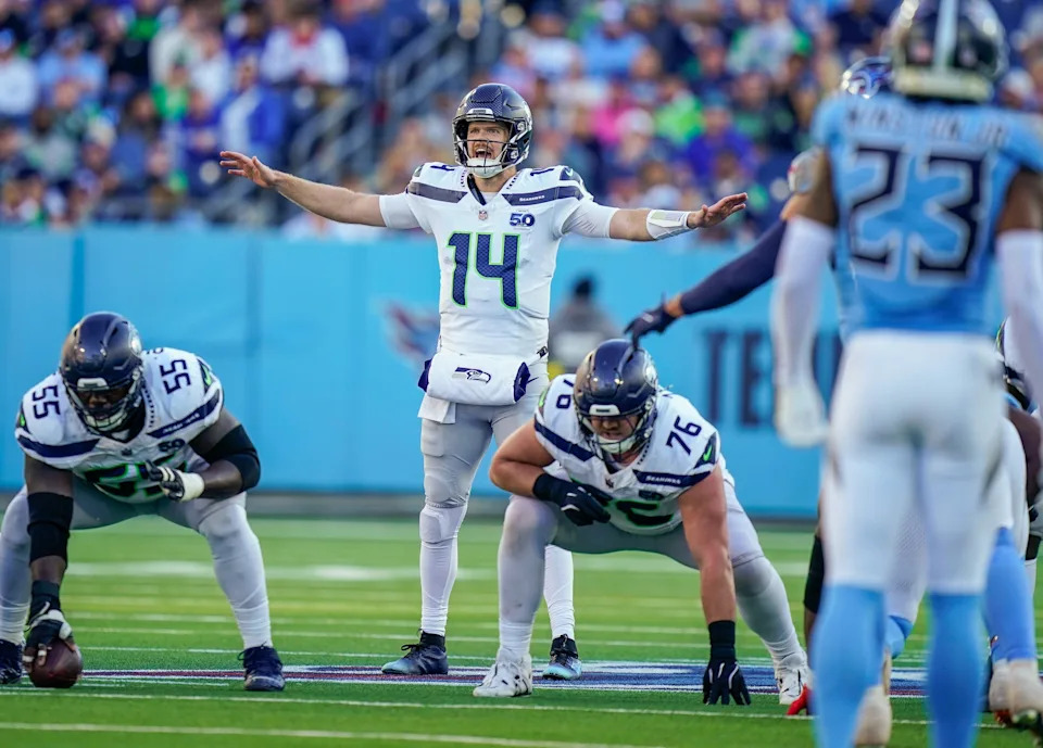 Seattle Seahawks quarterback Sam Darnold calls to teammates on a third down play.