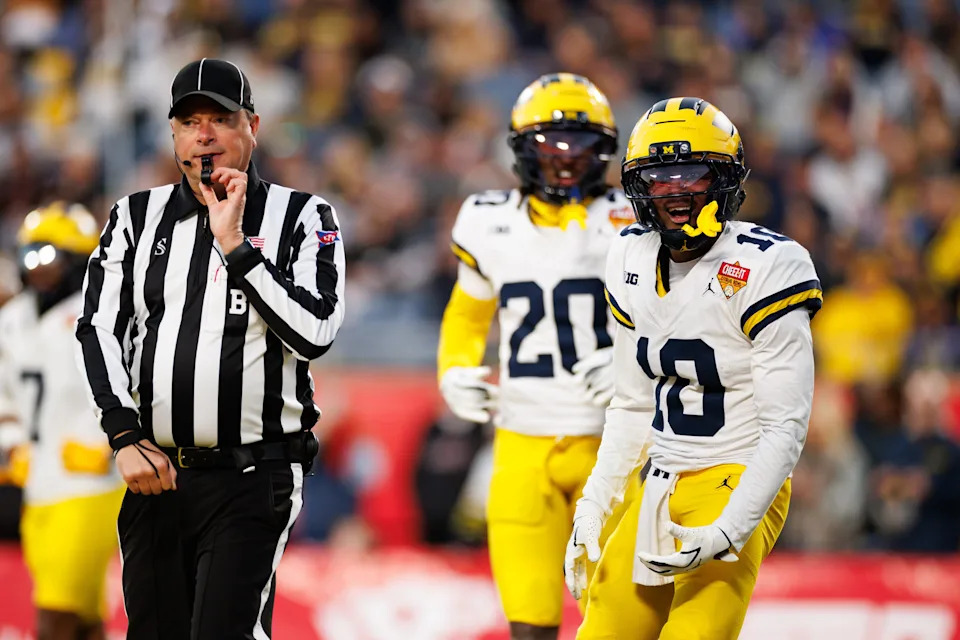 Michigan Wolverines defensive back Zeke Berry (10) argues a call with an official against the Texas Longhorns during the second half at Camping World Stadium in Orlando, Florida, on Wednesday, Dec. 31, 2025.