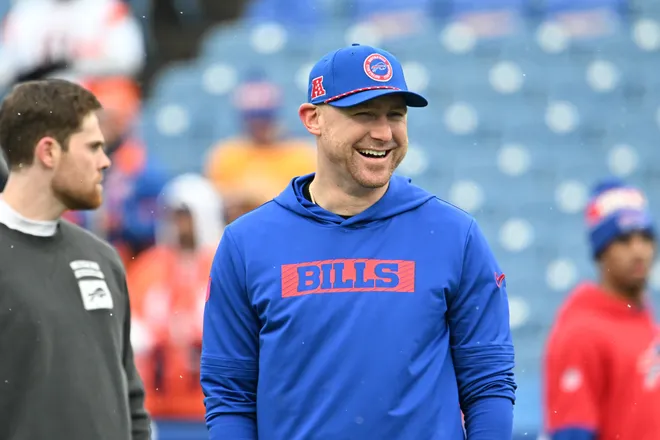 Jan 12, 2025; Orchard Park, New York, USA; Buffalo Bills offensive coordinator Joe Brady watches warmups prior to a game against the Denver Broncos in an AFC wild card game at Highmark Stadium. Mandatory Credit: Mark Konezny-Imagn Images