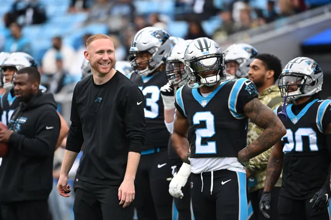 Nov 21, 2021; Charlotte, North Carolina, USA; Carolina Panthers assistant coach Joe Brady and wide receiver D.J. Moore (2) on the field before the game at Bank of America Stadium. Mandatory Credit: Bob Donnan-USA TODAY Sports