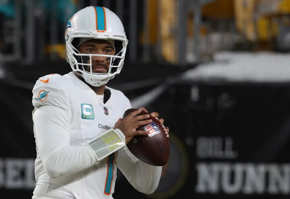 Dec 15, 2025; Pittsburgh, Pennsylvania, USA; Miami Dolphins quarterback Tua Tagovailoa (1) warm ups prior to the game against the Pittsburgh Steelers at Acrisure Stadium. Charles LeClaire-Imagn Images