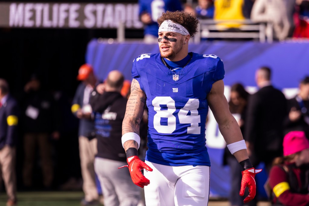 Tight end Theo Johnson #84 of the New York Giants on the field during warm-ups at MetLife Stadium.