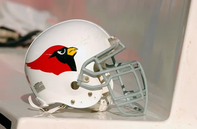 The helmet of the Arizona Cardinals sits on their team bench during the game against the Chicago Bears on November 30, 2003 at Soldier Field in Chicago, Illinois.