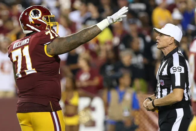 Sep 24, 2017; Landover, MD, USA; Washington Redskins offensive tackle Trent Williams (71) gestures to referee Tony Corrente (99) after being flagged for a penalty against the Oakland Raiders at FedEx Field. Mandatory Credit: Geoff Burke-USA TODAY Sports