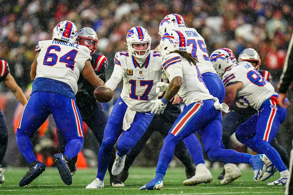 Buffalo Bills quarterback Josh Allen (17) hands off the ball against the New England Patriots.David Butler II-Imagn Images