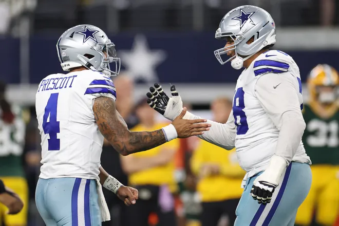 ARLINGTON, TEXAS - SEPTEMBER 28: Dak Prescott #4 of the Dallas Cowboys celebrates a touchdown with teammate Terence Steele #78 of the Dallas Cowboys against the Green Bay Packers during the fourth quarter in the game at AT&T Stadium on September 28, 2025 in Arlington, Texas. (Photo by Stacy Revere/Getty Images)