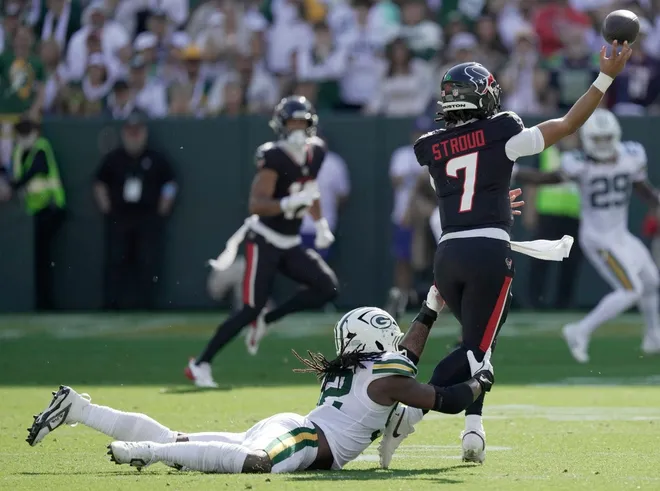 Green Bay Packers defensive end Rashan Gary (52) pressures Houston Texans quarterback C.J. Stroud (7) during the second quarter of their game Sunday, October 20, 2024 at Lambeau Field in Green Bay, Wisconsin.