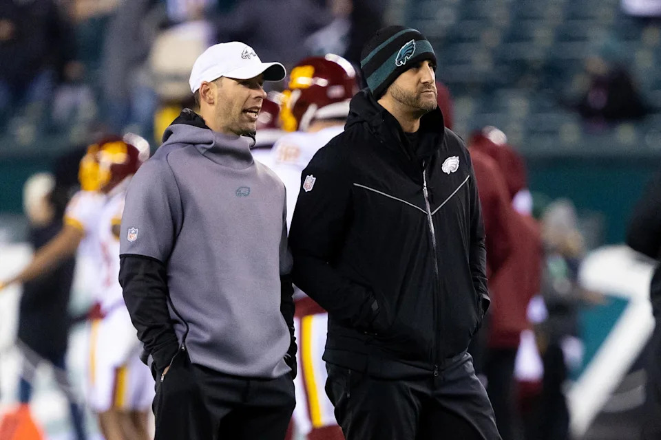 Dec 21, 2021; Philadelphia, Pennsylvania, USA; Philadelphia Eagles head coach Nick Sirianni (R) and defensive coordinator Jonathan Gannon (L) before action against the Washington Football Team at Lincoln Financial Field. Mandatory Credit: Bill Streicher-Imagn Images.