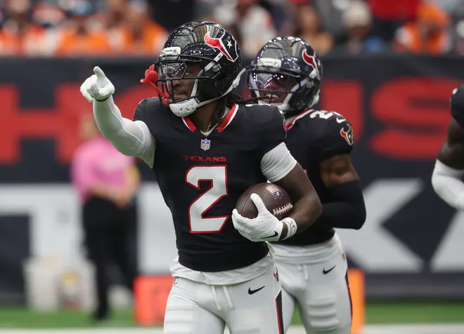 Nov 2, 2025; Houston, Texas, USA; Houston Texans safety Calen Bullock (2) celebrates after an interception during the first half Denver Broncos at NRG Stadium. Mandatory Credit: Thomas Shea-Imagn Images