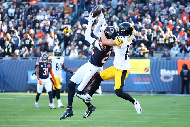 Nov 23, 2025; Chicago, Illinois, USA; Chicago Bears cornerback Nahshon Wright (26) breaks up a pass against Pittsburgh Steelers wide receiver Roman Wilson (10) during the second half at Soldier Field. Mandatory Credit: Mike Dinovo-Imagn Images