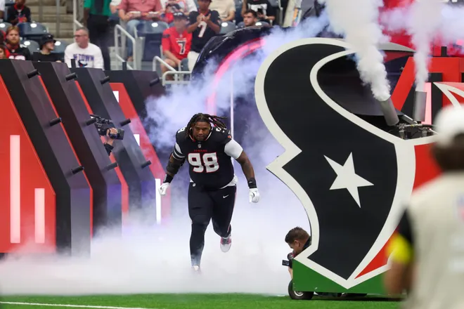 Nov 9, 2025; Houston, Texas, USA; Houston Texans defensive tackle Tim Settle Jr. (98) takes the field prior to a game against the Jacksonville Jaguars at NRG Stadium. Mandatory Credit: Thomas Shea-Imagn Images