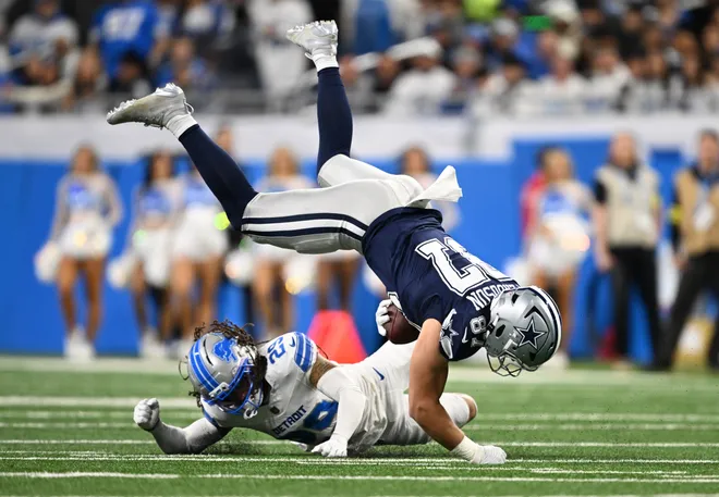 Dec 4, 2025; Detroit, Michigan, USA; Detroit Lions cornerback Avonte Maddox (29) tackles Dallas Cowboys tight end Jake Ferguson (87) during the first half at Ford Field. Mandatory Credit: Lon Horwedel-Imagn Images