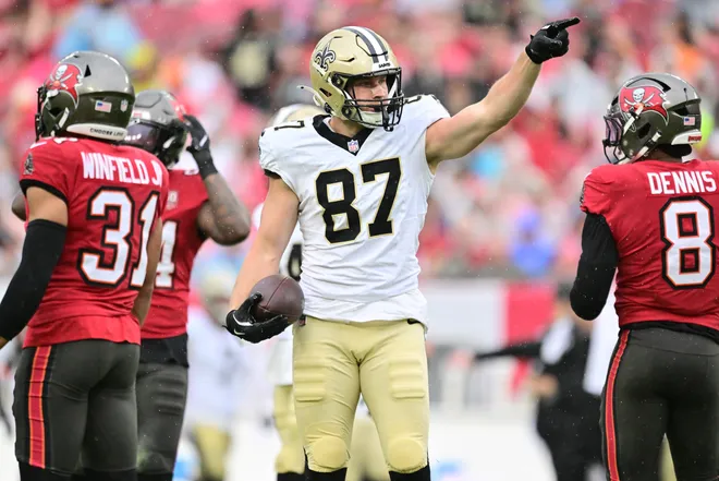 TAMPA, FLORIDA - DECEMBER 07: Foster Moreau #87 of the New Orleans Saints reacts after a first down against the Tampa Bay Buccaneers during the first half at Raymond James Stadium on December 07, 2025 in Tampa, Florida. (Photo by Julio Aguilar/Getty Images)