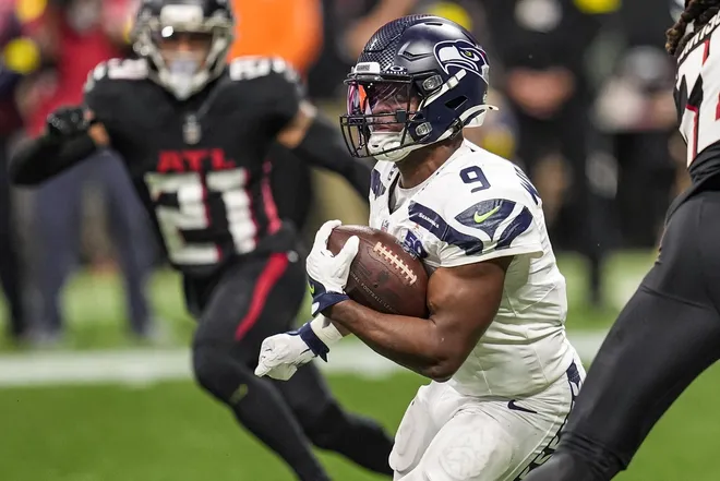 Dec 7, 2025; Atlanta, Georgia, USA; Seattle Seahawks running back Kenneth Walker III (9) runs against the Atlanta Falcons during the game at Mercedes-Benz Stadium.