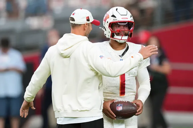 Sep 25, 2025; Glendale, Arizona, USA; Arizona Cardinals quarterback Kyler Murray (1) and head coach Jonathan Gannon talk before the game against the Seattle Seahawks at State Farm Stadium. Mandatory Credit: Joe Camporeale-Imagn Images