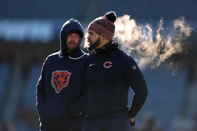 CHICAGO, ILLINOIS - DECEMBER 14: Offensive coordinator Declan Doyle and Caleb Williams #18 of the Chicago Bears look on prior to a game against the Cleveland Browns at Soldier Field on December 14, 2025 in Chicago, Illinois. (Photo by Michael Reaves/Getty Images)