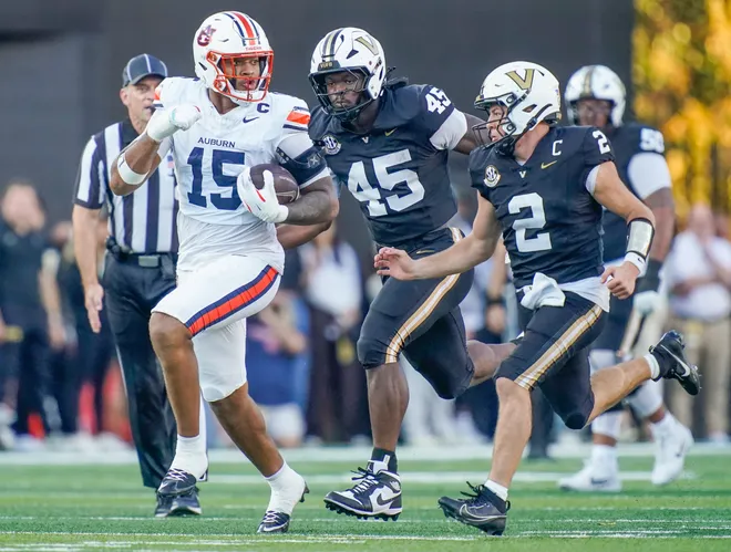 Auburn defensive end Keldric Faulk (15) runs after recovering a Vanderbilt fumble during the second quarter at FirstBank Stadium in Nashville, Tenn., Saturday, Nov. 8, 2025.