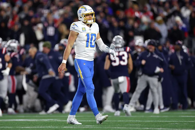 FOXBOROUGH, MASSACHUSETTS - JANUARY 11: Justin Herbert #10 of the Los Angeles Chargers reacts after a play against the New England Patriots during the first quarter of the AFC Wild Card Playoff game at Gillette Stadium on January 11, 2026 in Foxborough, Massachusetts. (Photo by Sarah Stier/Getty Images)