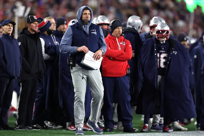 FOXBOROUGH, MASSACHUSETTS - JANUARY 11: Head coach Mike Vrabel of the New England Patriots looks on during the first half of the AFC Wild Card Playoff game against the Los Angeles Chargers at Gillette Stadium on January 11, 2026 in Foxborough, Massachusetts. (Photo by Adam Glanzman/Getty Images)