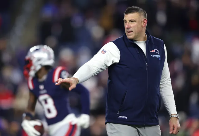 FOXBOROUGH, MASSACHUSETTS - JANUARY 11: Head coach Mike Vrabel of the New England Patriots looks on during warmups before the AFC Wild Card Playoff game against the Los Angeles Chargers at Gillette Stadium on January 11, 2026 in Foxborough, Massachusetts. (Photo by Adam Glanzman/Getty Images)