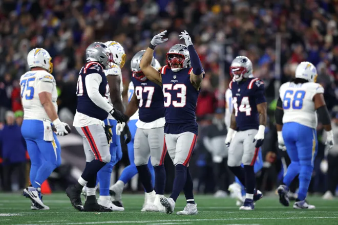 FOXBOROUGH, MASSACHUSETTS - JANUARY 11: Christian Elliss #53 of the New England Patriots reacts after a play against the Los Angeles Chargers during the first quarter in the AFC Wild Card Playoff game at Gillette Stadium on January 11, 2026 in Foxborough, Massachusetts. (Photo by Adam Glanzman/Getty Images)