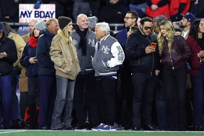 FOXBOROUGH, MASSACHUSETTS - JANUARY 11: Gianni Infantino, President of FIFA, speaks with owner Robert Kraft of the New England Patriots during warmups before the AFC Wild Card Playoff game against the Los Angeles Chargers at Gillette Stadium on January 11, 2026 in Foxborough, Massachusetts. (Photo by Adam Glanzman/Getty Images)
