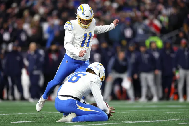 FOXBOROUGH, MASSACHUSETTS - JANUARY 11: Cameron Dicker #11 of the Los Angeles Chargers kicks a field goal against the New England Patriots during the second quarter of the AFC Wild Card Playoff game at Gillette Stadium on January 11, 2026 in Foxborough, Massachusetts. (Photo by Sarah Stier/Getty Images)