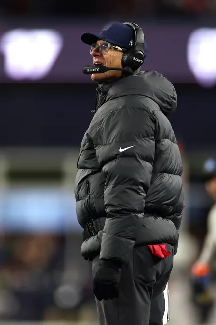 FOXBOROUGH, MASSACHUSETTS - JANUARY 11: Head coach Jim Harbaugh of the Los Angeles Chargers looks on during the second quarter against the New England Patriots of the AFC Wild Card Playoff game at Gillette Stadium on January 11, 2026 in Foxborough, Massachusetts. (Photo by Sarah Stier/Getty Images)